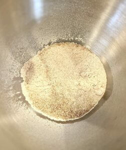 Sprouted wheat flour freshly milled in a bowl.